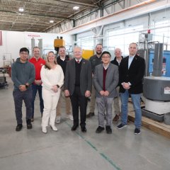 Photo of group of people standing inside the new IACMI METAL workforce training hub at Ohio State University