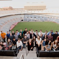 Photo of former IACMI interns at the University of Tennessee stadium