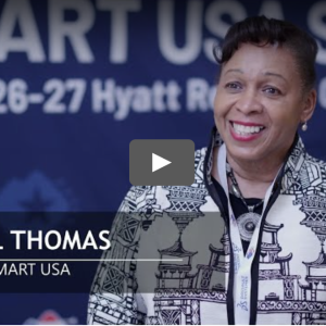 Screengrab of the SMART USA 2025 Summit highlight real with a still shot of Carroll Thomas, the board chair of SMART USA