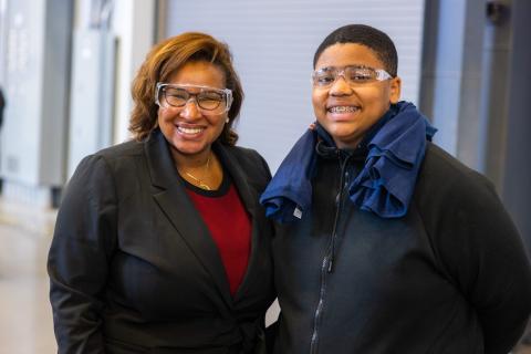 Halimah Najieb-Locke, deputy assistant secretary of defense for industrial base resilience, and Victor Haynes, an 8th grade student from Vine Middle School, pose for a photo during the inaugural SEC Machining Competition held at the University of Tennessee’s new Manufacturing and Design Enterprise in Hardin Valley, Tennessee on November 18, 2022. Photo by Steven Bridges/University of Tennessee.