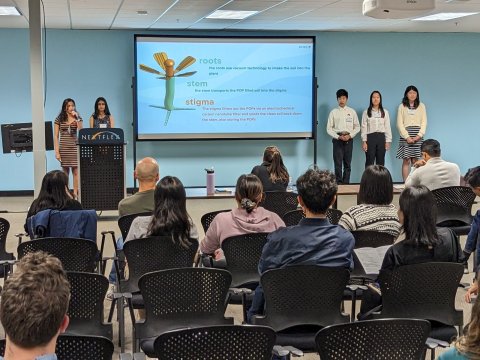 Students giving a presentation. Photo courtesy of FlexFactor/NextFlex