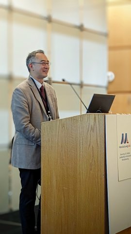 Photo of Dr. Eric Lin speaking at the podium at the 2023 Manufacturing USA Annual Network Meeting
