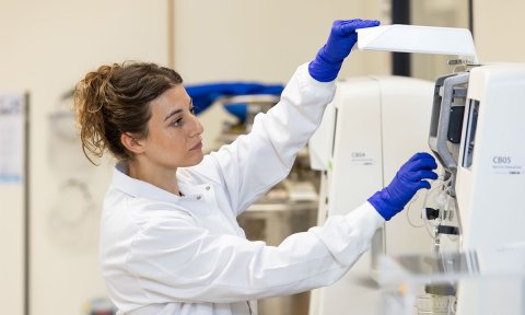 Photo of a female scientist working in BioFabUSA's Tissue Foundry.