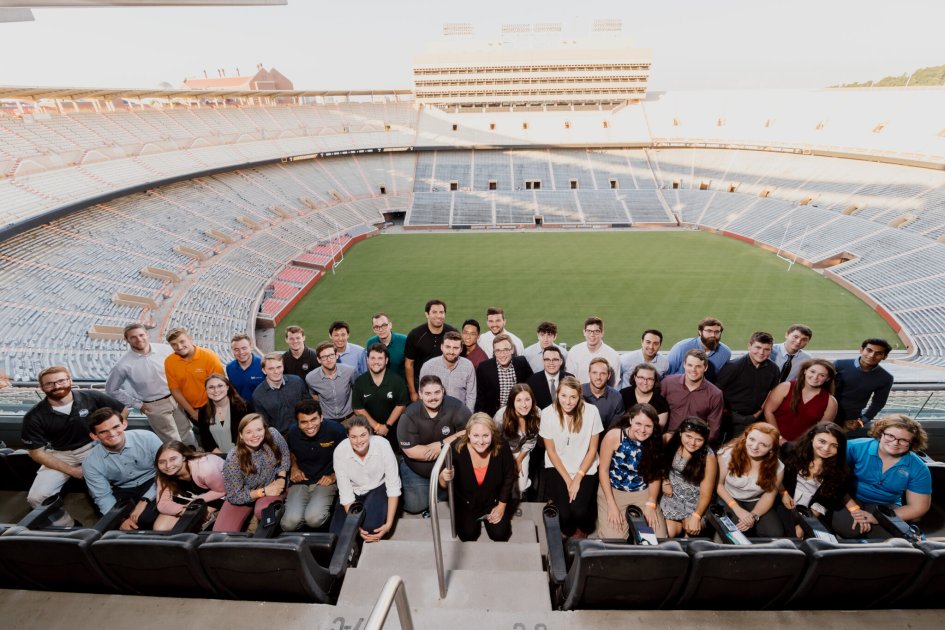 Photo of former IACMI interns at the University of Tennessee stadium
