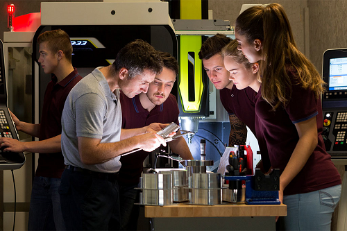 Photograph of students working collaboratively on a manufacturing project