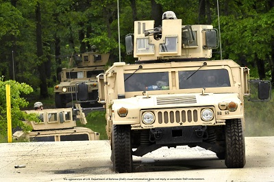 U.S. Army Calvary Scouts in up armored HMMWV gun trucks conduct a field training exercise