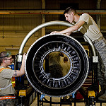 Members of the Air Force 8th Maintenance Squadron, install augmenter fuel spray bars on an F-16 Fighting Falcon engine.